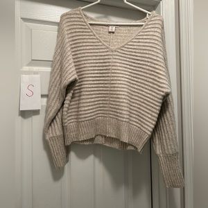 Small cream colored v-neck sweater